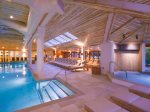 Indoor heated pool and hydromassage waterfall in hot tub